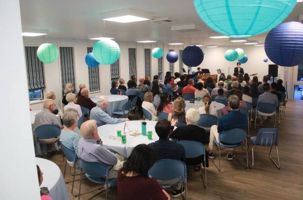 The fundraiser crowd gathers at the Mercer Island United Methodist Church Fellowship Hall. Photo courtesy of Brooks Kahsai
