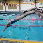 Gracyn Kehoe, front, and a teammate dive off the starting block into Mary Wayte Pool during a recent practice. Courtesy photo