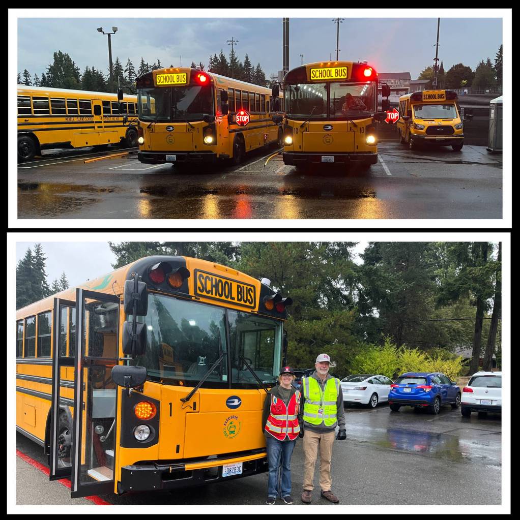 Mercer Island School Districts two electric buses ran their first routes on the morning of Sept. 25, with drivers transporting students to Mercer Island High School, Islander Middle School, and Lakeridge and West Mercer elementaries. Top, the buses prepare to get rolling. Bottom, Jo Simms (left) and Mo Youngs in front of one of the buses at Islander Middle School. Simms drove the pictured bus and Youngs drove the other one. They had just delivered students to the school. Photos courtesy of the Mercer Island School District