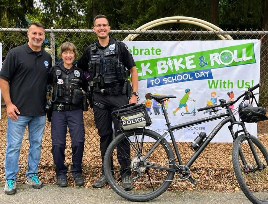 From left, Mercer Island Mayor Salim Nice, Mercer Island Police Department police support officer Anna Ormsby and officer Chase Erickson visited Island Park Elementary School on the morning of Oct. 4 for the schools Walk, Bike and Roll to School Day. Photo courtesy of the Mercer Island Police Department