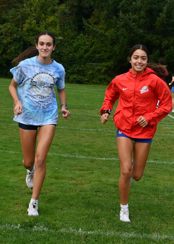 Victoria Rodriguez, left, and Sophia Rodriguez are new to the Mercer Island High School cross country team this season after moving to the Island with their family from York, Pennsylvania. Andy Nystrom/ staff photo