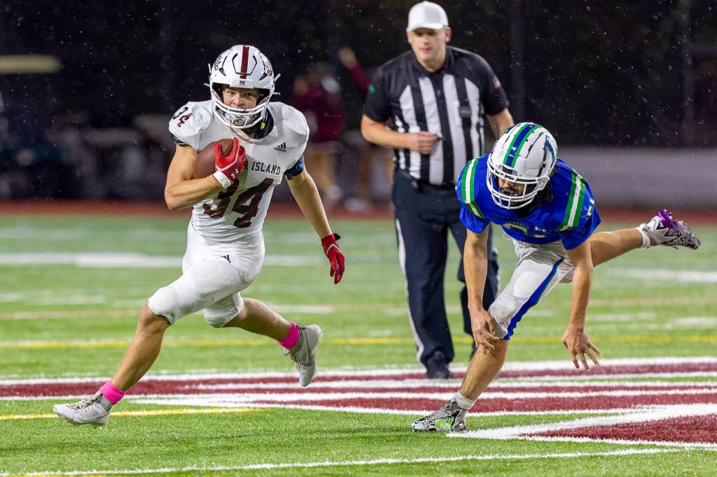 Mercer Islands Luke Myklebust blasts up field during the Islanders 24-20 football victory over Liberty (Renton) on Oct 13. Following the Homecoming game win, MI is currently the No. 2 seed in 3A KingCo with a 3-1 league record and 5-2 overall record. For MI, quarterback Spencer Kornblum was 10-for-11 passing for 111 yards and one touchdown; Cole Krawiec had 26 carries for 155 yards and one TD; Cole Rowe had two catches for 37 yards and one TD; Ryan Boyle had five catches for 52 yards; Myklebust had 14 carries for 70 yards; and Ethan Kercher kicked a field goal. Photo courtesy of Linda Kercher