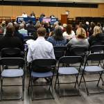 Attendees gathered to listen to city council candidates, from left to right, Michael Curry, Craig Reynolds, Andrew Friedman and Jake Jacobson, as they answered questions during the Mercer Island Candidate Forum on Oct. 18 at Islander Middle School. Andy Nystrom/ staff photo