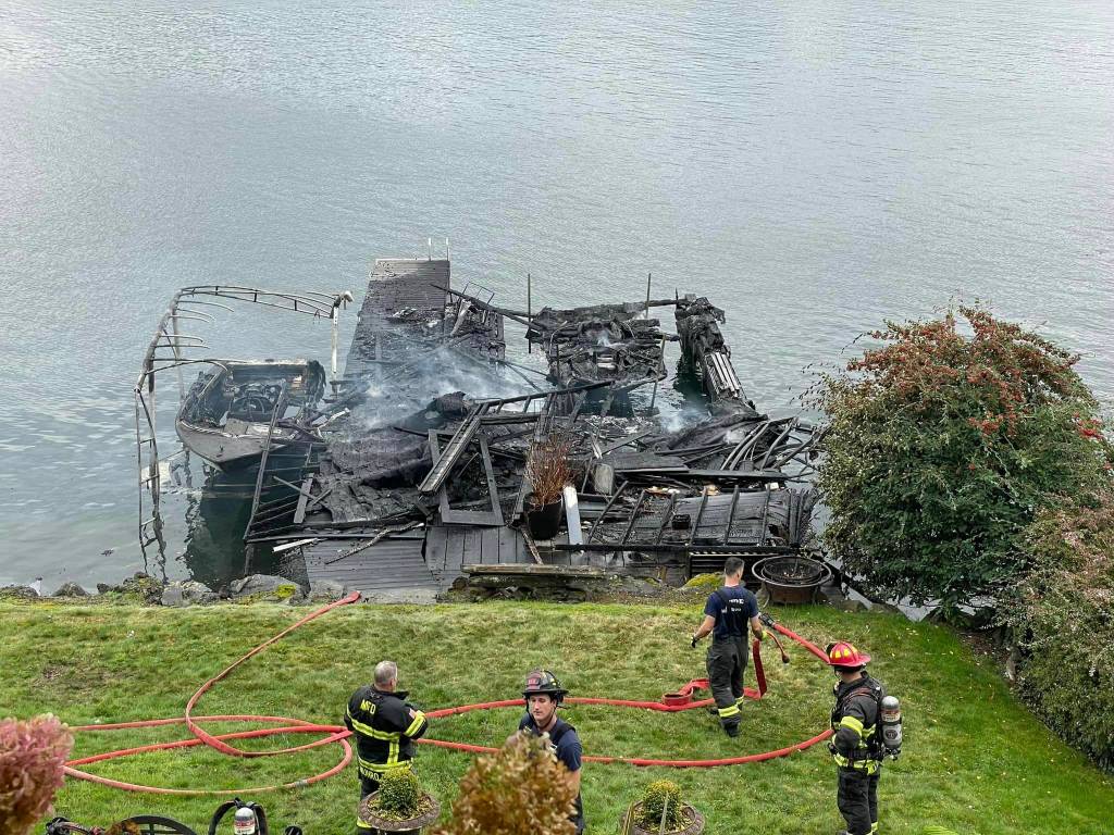 Mercer Island fire crews extinguished a dock and boat fire and stabilized the scene on the afternoon of Oct. 23 near the 9000 block of North Mercer Way. No injuries were reported. Crews from Eastside Fire & Rescue (EF&R) and Bellevue Fire provided assistance, and Bellevue fire investigators are working to determine the cause of the fire. According to EF&R, the call came in at 2:31 p.m. and the first unit arrived on scene six minutes later. After crews had the fire under control at 3:06 p.m., they commenced overhaul work and command was terminated at 7:32 p.m. Crews remained on scene for firewatch overnight. Photo courtesy of the Mercer Island Police Department