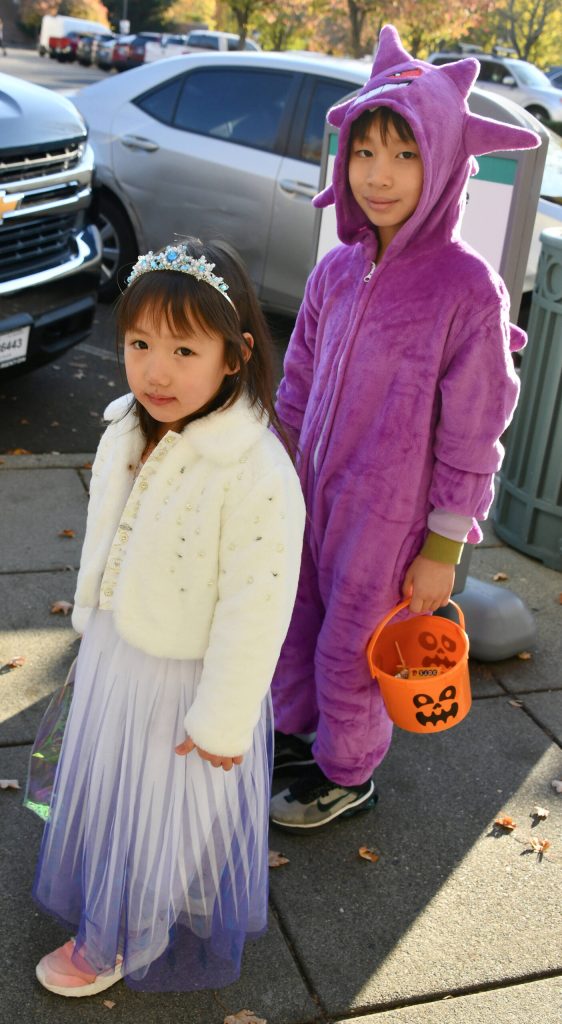 Kase and Aiden Lu stop along their route. Andy Nystrom/ staff photo
