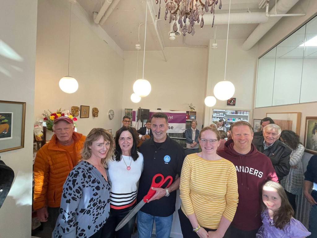 Pictured at the MercyVet open house and ribbon cutting on Oct. 27 are, from left to right: City councilmember Jake Jacobson, hospital manager Daisy Whitley, founder and doctor of veterinary medicine Jacqueline Sehn, Mayor Salim Nice, associate veterinarian Kim Primack, Deputy Mayor Dave Rosenbaum with his daughter and several MercyVet clients. Courtesy photo