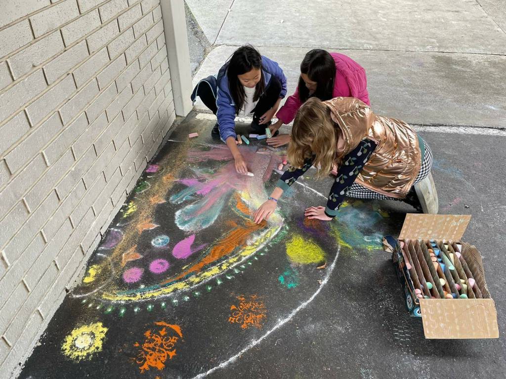 West Mercer Elementary School students paint Rangoli designs with sidewalk chalk to celebrate Diwali on Nov. 13. Photo courtesy of the Mercer Island School District