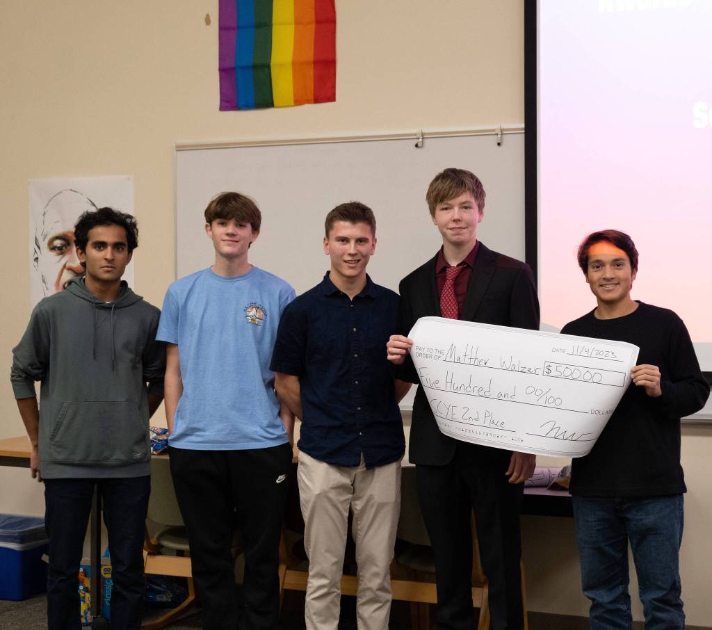 From left to right at the Seattle Competition for Young Entrepreneurs business plan competition on Nov. 4, Ashwin Krishnaswamy (officer), Douglas Stovall (vice president), Benjamin Viafore (treasurer), second-placer Matthew Walzer and Nikesh Woerner (president). Courtesy photo