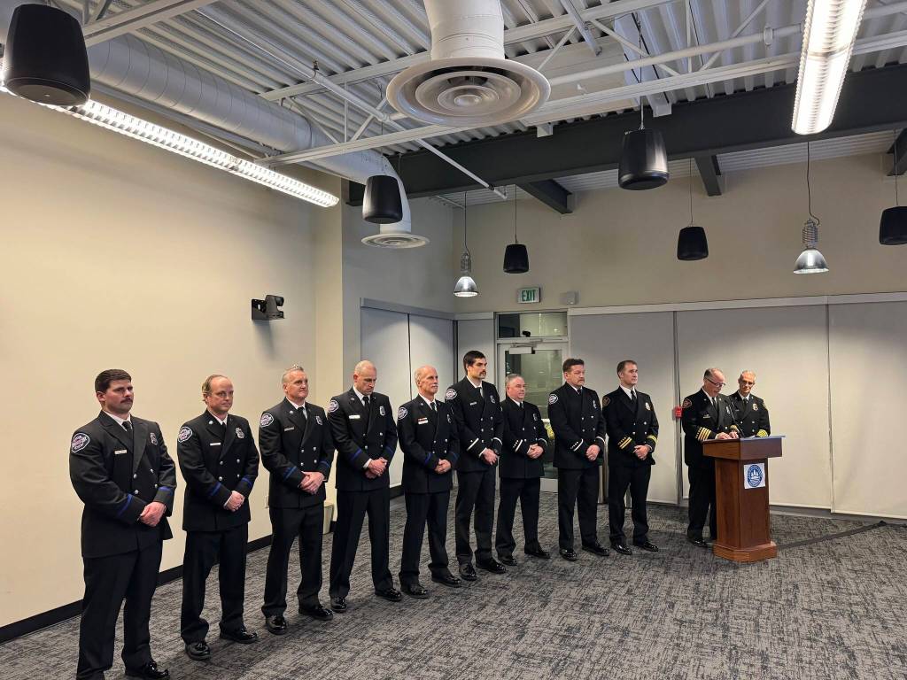 A host of Mercer Island firefighters were pinned at a promotional ceremony at the Dec. 5 Mercer Island City Council meeting. Fourteen firefighters were promoted as part of the citys transition to Eastside Fire & Rescue; not all were present at the meeting. Photo courtesy of the city of Mercer Island