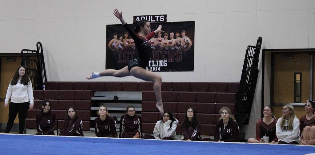 Bella Nguyen leaps into action on the floor this season. Photo courtesy of Miller Fosseen