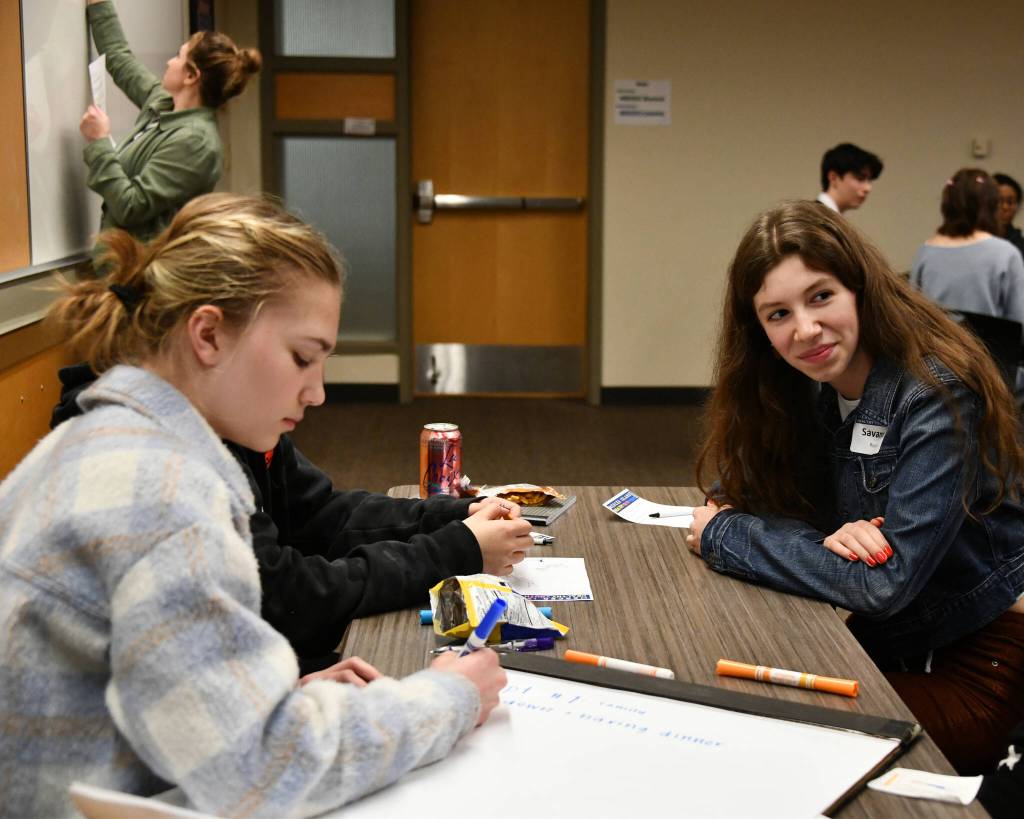 Mercer Island High Schools Savanna Rousell, right, listens to a fellow student while Ina Shapiro, left, takes notes during a breakout session at the MI Healthy Youth Forum on Jan. 31 at the Mercer Island Community and Event Center. Andy Nystrom/ staff photo