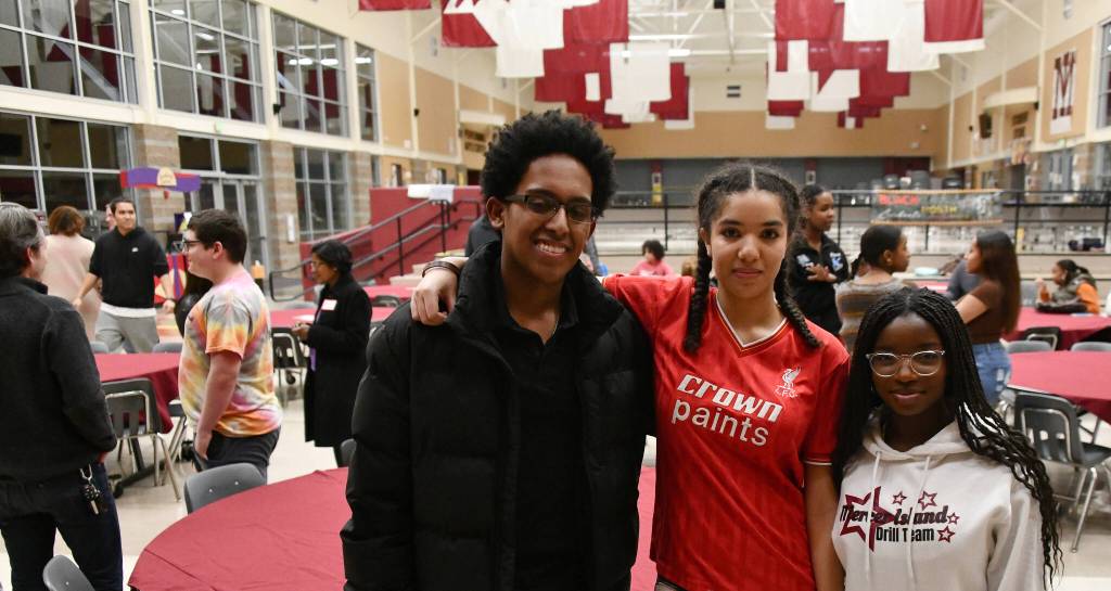 Andy Nystrom/ staff photo
From left to right, Mercer Island High School Black Student Union members Tewodros (Teddy) Sanchez-Alemu, Jada Jorgensen and Omolara Olusanya gather at the unions community dinner on Feb. 7 in the school commons.