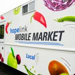 Hopelinks Mobile Market truck features free fresh and shelf-stable goods like vegetables, fruit, canned meats and soups, proteins, peppers, apples, pastas, rice and more. Photo courtesy of Hopelink