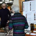 Attendees interact at the Elderwise booth. Andy Nystrom/ staff photo