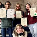 Six Mercer Island High School (MIHS) journalism and yearbook students placed at the annual Washington Journalism Education Association (WJEA) write-off contest on March 9 at Arlington High School. The students competed against high school students from around the state and placed in all but one of the categories they entered. Superior: Jordan Balousek (news writing) and Ashwin Krishnaswamy (news feature writing). Excellent: Kyle Gerstel (editorial writing). Honorable mention: Maddie Gaspers (news photography), Mischa Gregory (yearbook photography) and Taylor Holshouser (news layout). In addition to competing, students attended breakout sessions led by industry professionals, including a session conducted by Lee Hardisty from the MIHS Class of 2022. Pictured are: left to right standing, Krishnaswamy, Gaspers and Balousek. Bottom, Hardisty. Photo courtesy of the Mercer Island School District