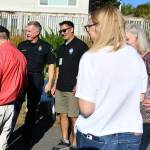 Mercer Island Police Department Chief Ed Holmes, center, visits with residents at a National Night Out event at Rep. Tana Senns home on Aug. 1, 2023. To Holmes right is Mayor Salim Nice. Andy Nystrom/ staff photo
