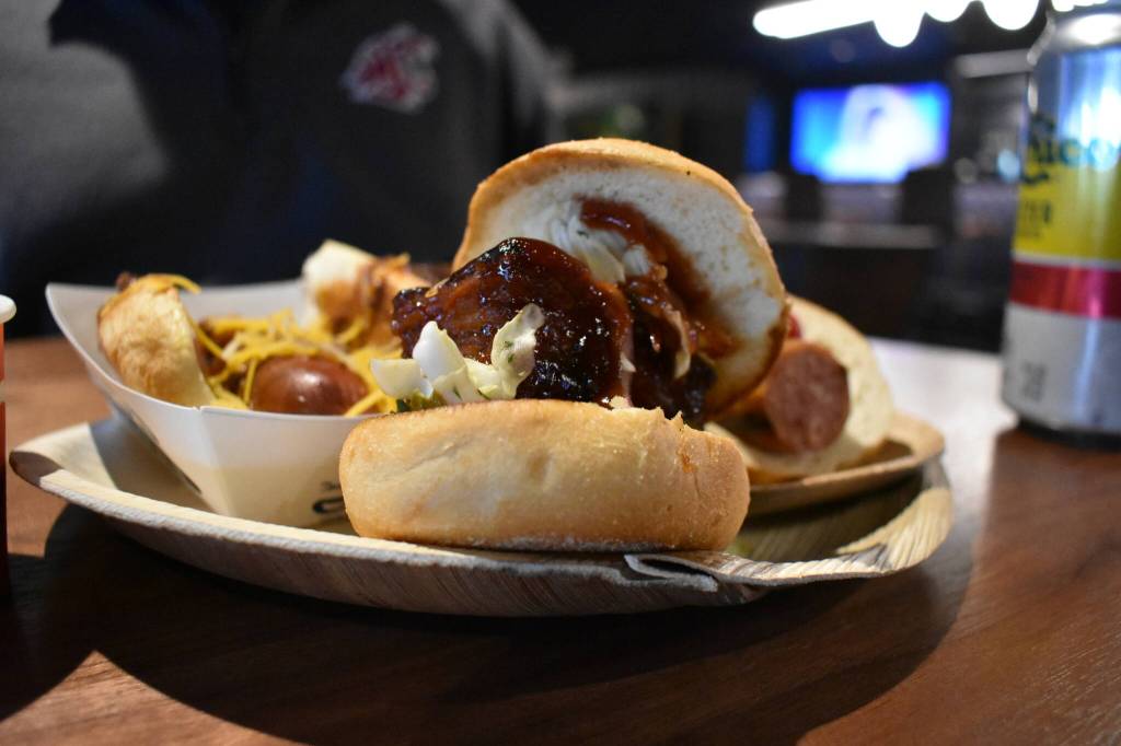 A plate of food, showcased with a porkbelly sandwich. Ben Ray / The Reporter
