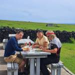In Tristan Da Cunha, from left, Balthasar Wyss, Marcelo Osanai and Nina Pope sailboat captain Benno Frey. Courtesy photo