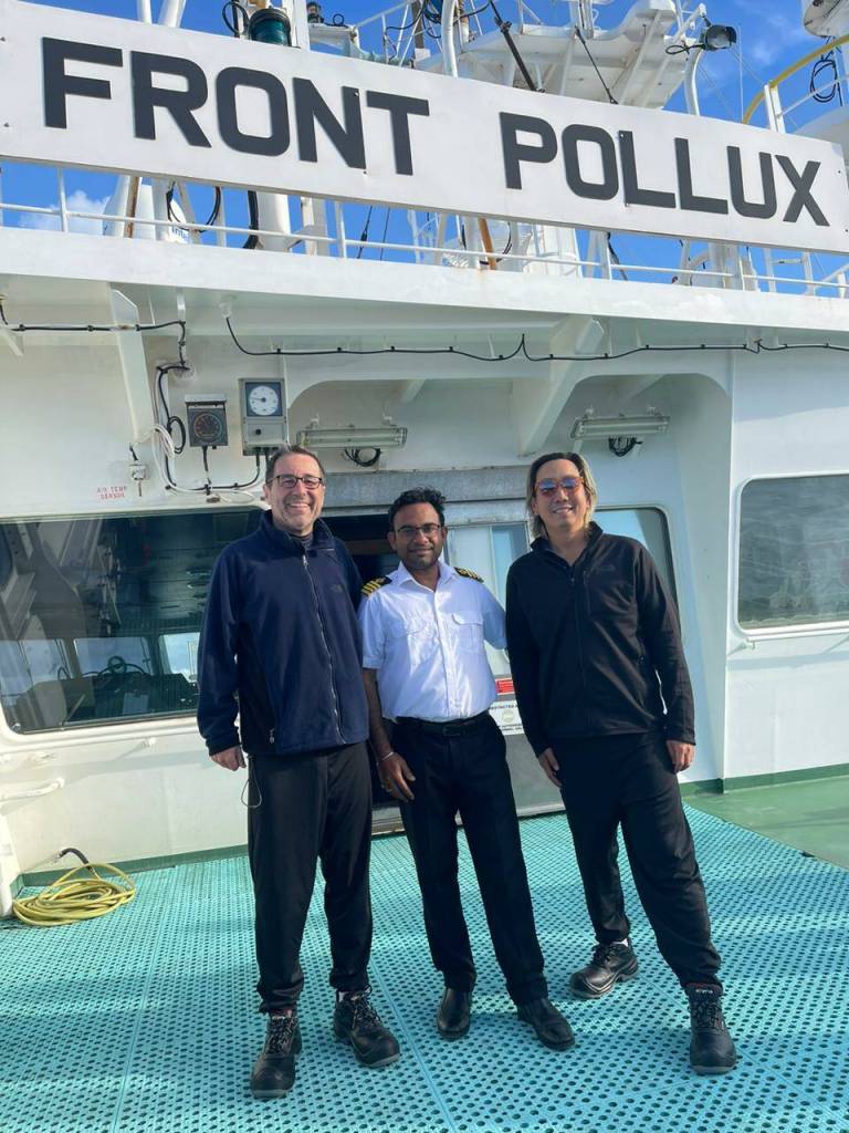 From left, Balthasar Wyss with Captain Ravi (Ravichandra Vijayshankar Yadav) of the Front Pollux oil tanker and crewmate Marcelo Osanai. Photo courtesy of the Front Pollux crew