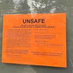 Some residents near 95th Court Southeast have these signs taped to their doors describing the landslide risk and were directed to evacuate their premises on April 3. Andy Nystrom/staff photo