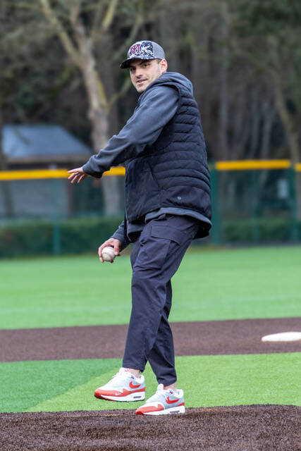 Mercer Island High School (MIHS) class of 2018 alum Greg Fuchs tosses a pitch at the MIHS baseball alumni and fan appreciation night on April 4 at Island Crest Park. Photo courtesy of Bernard Mangold