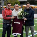 Former Mercer Island High School boys soccer head coach Colin Rigby, left, Jordan Morris, center, and former Islanders boys soccer head coach Forrest Marowitz pose for a quick photo on April 23, 2019, at Islander Stadium. Morris was inducted into the Mercer Island High School Athletic Hall of Fame. Photo courtesy of Kim Otte