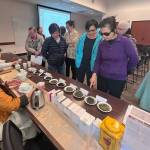 Attendees line up for a tea tasting at the Mercer Island Chinese Association event on April 17 at the Mercer Island Library. Photo courtesy of Fan Yuan