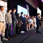 Mercer Islands Tyler Bienstock voices his senior reflection to the crowd as his fellow 2024 Friendship Circle graduates stand behind him. Mia Haslam also gave a senior reflection speech. Andy Nystrom/ staff photo