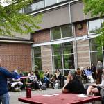 Mercer Island High School Principal Nick Wold announces a plethora of student achievements on May 13 in the school courtyard. Andy Nystrom/ staff photo