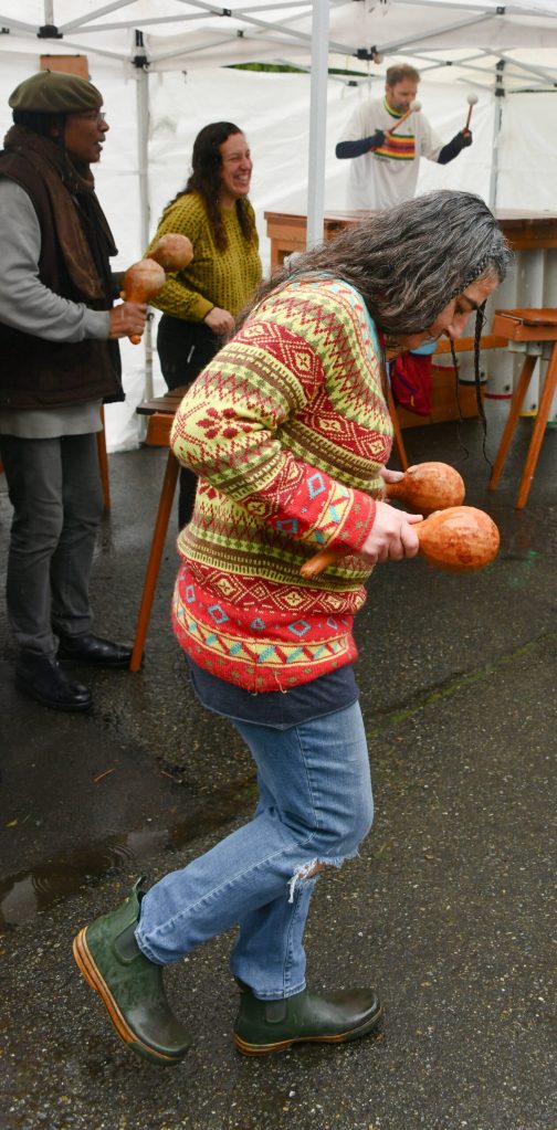 Laura Berryhill dances while playing the hosho hand percussion with Yaamba Marimba. Andy Nystrom/ staff photo