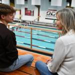 From left to right, Piper Enge and Mary Wayte discuss their swimming careers on June 2 at the Mary Wayte Pool on Mercer Island. Andy Nystrom/ staff photo