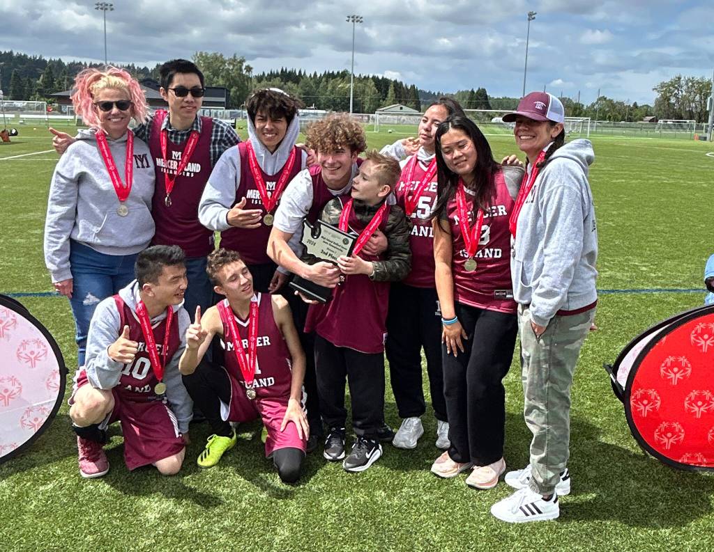 Mercer Island High Schools Unified Sports co-ed soccer team at the May 25 state championship game. From left to right: (Top) coach Jeniffer Blaser, Aaron Yang, Cortez Smith, Taven Glennon-Mulein, Madox Mulein (not on team), Jordan Balousek, Hayley Nguyen and coach Jamie Glennon. (Bottom) Gavin Fukano and Yura Vaganov. Photo courtesy of Janelle Brin