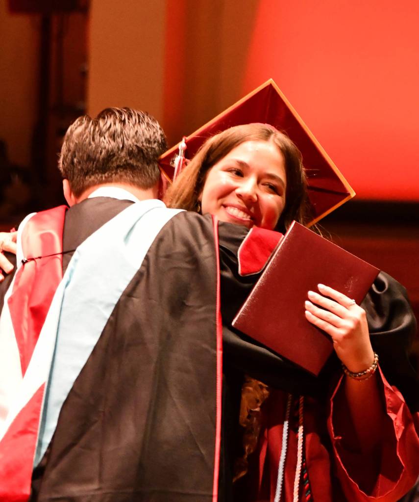 Alexandra Hyman receives a hug from Mercer Island School District Superintendent Dr. Fred Rundle. Andy Nystrom/ staff photo