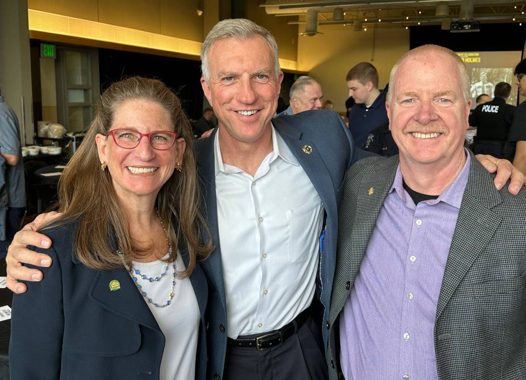 From left to right, Rep. Tana Senn, retired Mercer Island police chief Ed Holmes and retired Mercer Island fire chief Chris Tubbs. Photo courtesy of Greg Asimakoupoulos