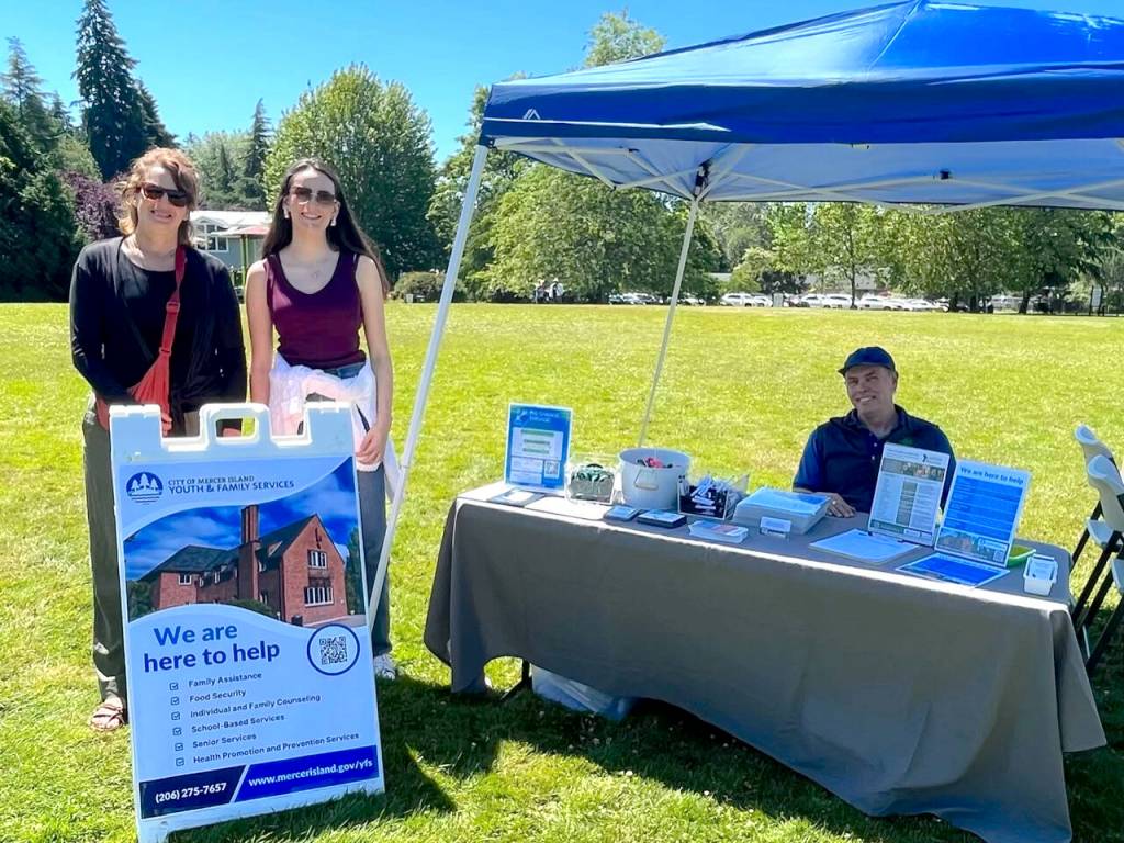 From left, Amy French, Mercer Island Youth and Family Services Foundation executive director; foundation summer intern Natalie Wingo; and YFS Administrator Derek Franklin attend the Juneteenth Community Celebration at Mercerdale Park. Courtesy photo