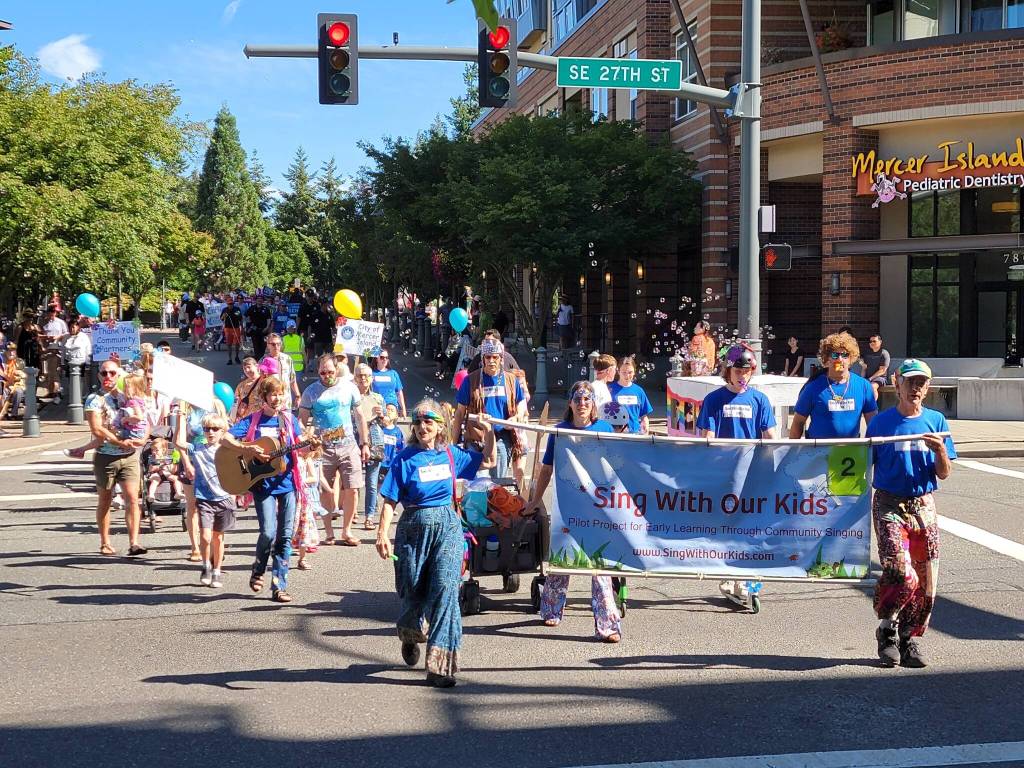 Nancy Stewarts Sing With Our Kids and a bevy of other participants roll through the Summer Celebration community parade last year. Photo courtesy of the city of Mercer Island