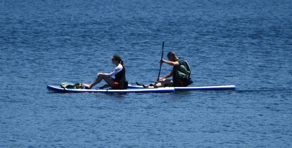A duo cruises across Lake Washington on July 8. Andy Nystrom/ staff photo