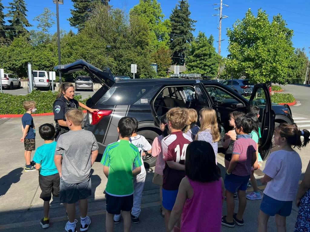 Mercer Island Police Department officer Kristina Lum visited with summer school students at Northwood Elementary on July 8 and displayed her police cruiser. Photo courtesy of Mercer Island School District