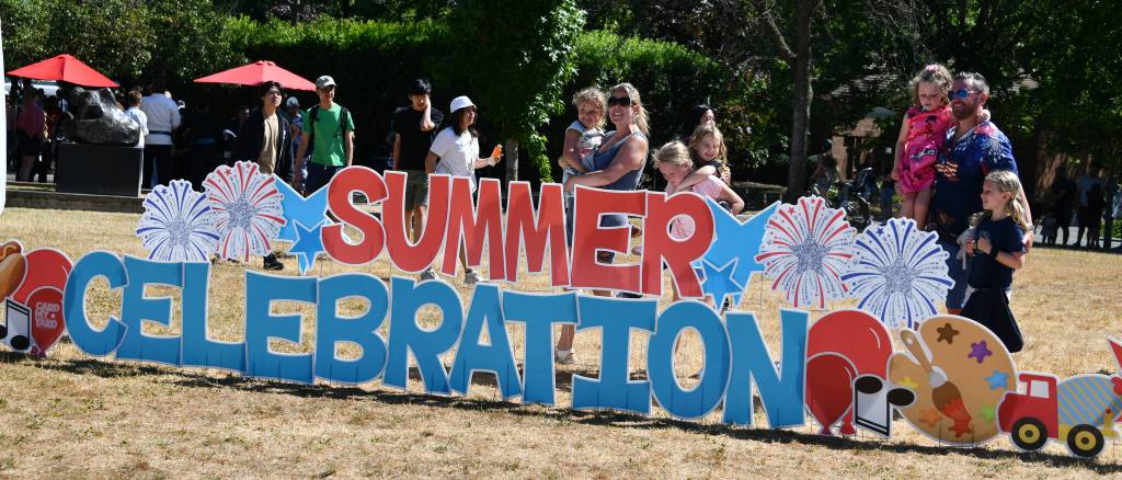 A family poses for a photo at Mercerdale Park. Andy Nystrom/ staff photo