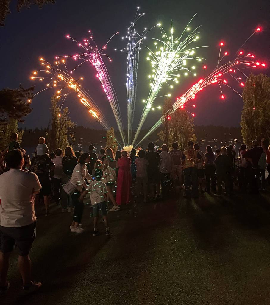 Summer Celebration attendees at Luther Burbank Park watch fireworks explode over Lake Washington. Photo courtesy of the city of Mercer Island