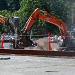 Construction workers plow away on July 8 at the future site of the Xing Hua mixed-use development project. Andy Nystrom/ staff photo