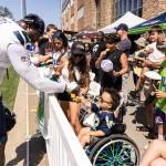 DK Metcalf shares a fist bump with a young fan. Photo provided by Maria Dorsten.