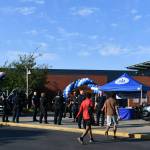 Mercer Island Police Department trucks and a marine patrol vessel, along with officers and Eastside Fire & Rescue workers, are situated at the entrance of the Mercer Island Community and Event Center on Aug. 6 for National Night Out. Andy Nystrom/ staff photo