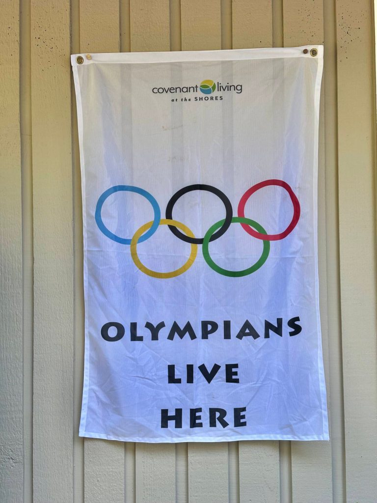This banner outside Greg Asimakoupoulos home illustrates that a competitor in the Olympics of Life lives inside. Courtesy photo