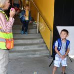 Northwood Elementary paraprofessional Katty Clark greets students with bubbles on the first day of school on Aug. 28. Andy Nystrom/ staff photo