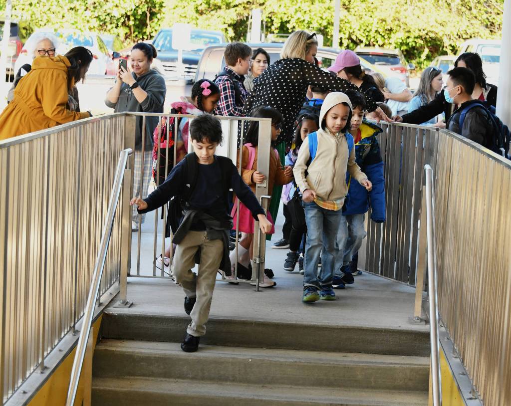 Northwood Elementary students walk through the main gate on their way to classes on the first day of school on Aug. 28. Andy Nystrom/ staff photo