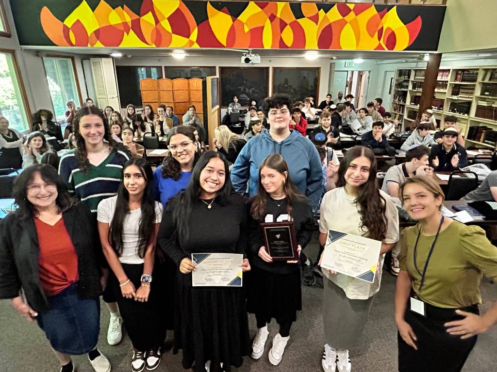 Joelle Keene, president and executive director of the Jewish Scholastic Press Association, visited Northwest Yeshiva High School (NYHS) on Aug. 29 to present a pair of awards to local students in the Emily Alhadeff-taught journalism department. Students received awards for their feature stories in the high school newspaper, The Mane Idea. Jenna Kaufthal, a recent NYHS graduate, won first place in a tie with Shalhevet High School in the category of News and feature reporting on current events involving Israel. The article, titled Answering the Call to Defend Israel, was featured by The Mane Idea in December of 2023. Elianna Rothstein, now an NYHS senior, won second place in the category of News or feature reporting on interreligious or intercultural activism or events for her December 2023 piece titled, Mercer Island Muslim and Jewish leaders work together against hate. Photo courtesy of Zelle Rettman