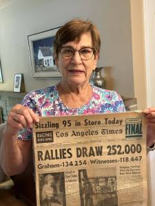 Gregs neighbor Linda Nicholl holding front page of Sept 9, 1963 LA Times featuring her fathers cover story Photo courtesy of Greg Asimakoupoulos