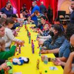 Attendees enjoy a lively game of Ladingo, similar to bingo, where participants can win prizes by having enough consecutive numbers called on their board. Photo courtesy of John Shaffer