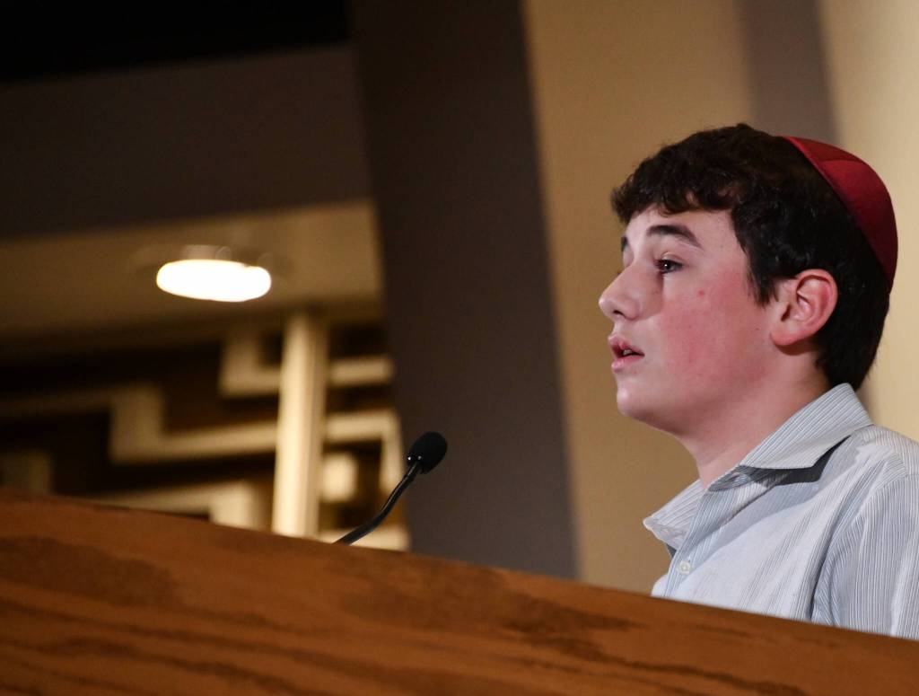 Issaquah High School student John Waldbaum speaks at the October 7: One Year Later commemoration. Andy Nystrom/ staff photo